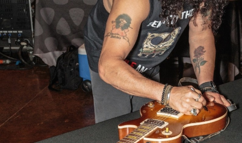 Grammy Award Winning Rockstar, SLASH, Signs Guitar At Hard Rock Hotel